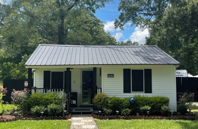 Tiny house with hot tub, kids play area, and fire pit