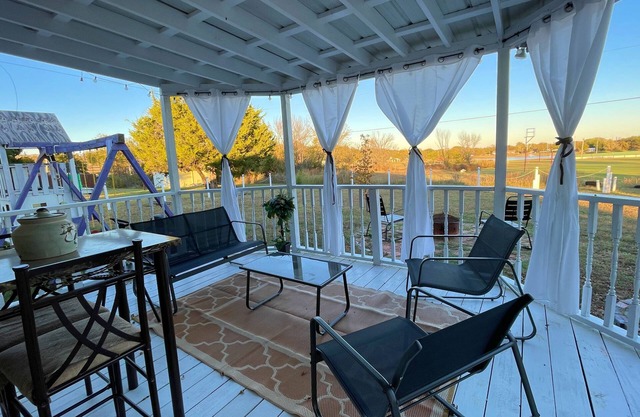 Trendy home with a scenic back porch, fish, golf and more