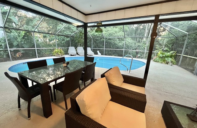 Tropical Oasis With HEATED Pool, Just minutes from the Downtown and the Beaches.