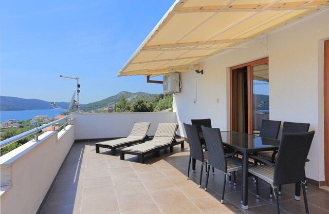 Two bedroom apartment with terrace and sea view Seget Vranjica, Trogir (A-11273-a)