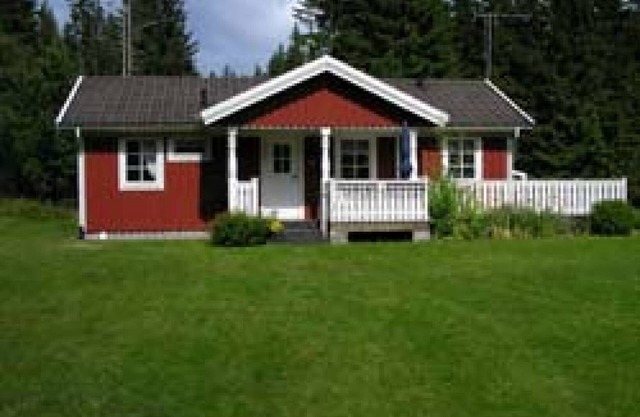 Typical red and white holiday home in the countryside in Småland
