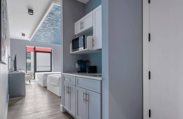 Upscale Double Queen Suite | Mott Haven | Fitness Center | Free WiFi