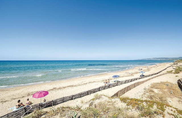 Vacation apartment on the 1st floor with shared pool 300 m from the sea in Valledoria.