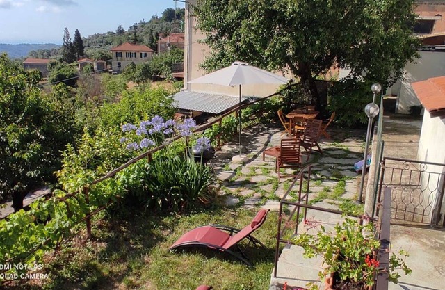 Village house in a panoramic location with a sunny garden and sea views