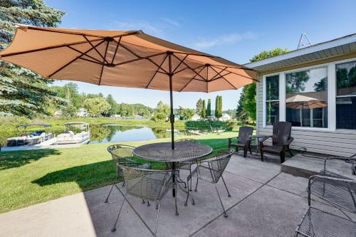 Waterfront Retreat with Dock and Yard in Reed City!