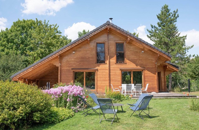 Wooden House in a green setting.