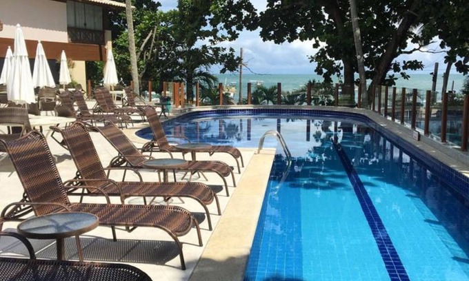 Praia do Forte Apartment | 2/4 BORN, FRONT BEACH, ALL INFRASTRUCTURE, GUARANTEED PRICE, SKY, WI-FI