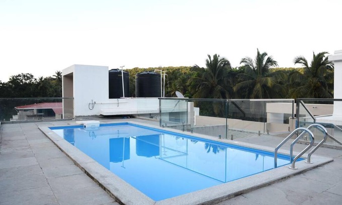 Bogmolo Apartment | 2BHK AC Apartment with Swimming pool close to beach and Airport!