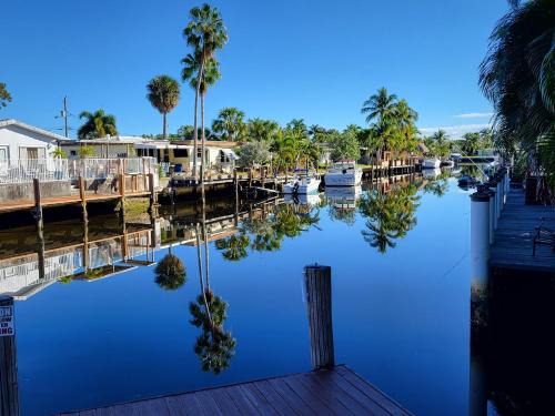 Garden Isles House | 4 bd Near beach spacious solar heated pool waterfront home
