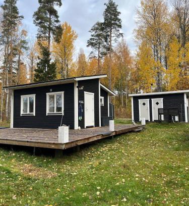 Grythyttan House | A simple stuga on a lake incinerating toilet in a separate building next to the cabin Water for drinking and washing hands dishes comes from two containers that attach to a faucet through a simple electric pump OBS no shower on site