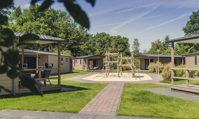Zuna Cabin | A spacious bungalow with a nice veranda and a view of the playground