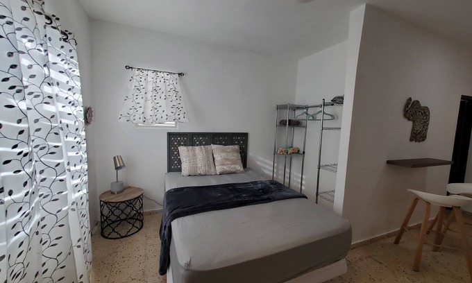 Borinquen Apartment | Aguadilla Surfers Lair Apt. with electricity,water A/C WIFI near Crashboat beach
