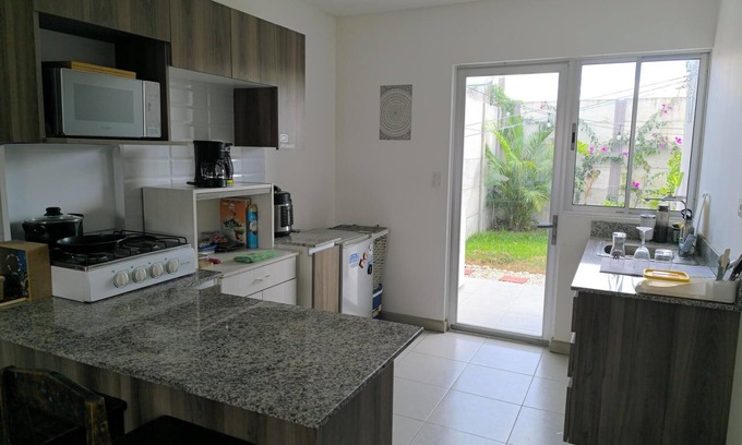 Guacima House | Alajuela Stay: Close to Airport, Viva Park & CAR with amenities like pool & gym