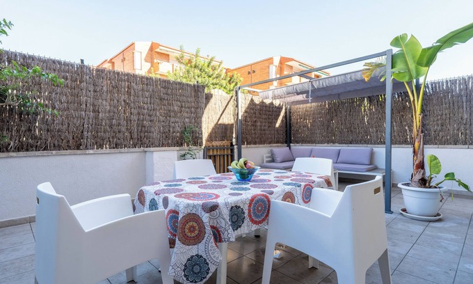 Comarruga Apartment | Apartment 'Near Beaches Large Private Patio' with Shared Pool, Wi-Fi and Air Conditioning
