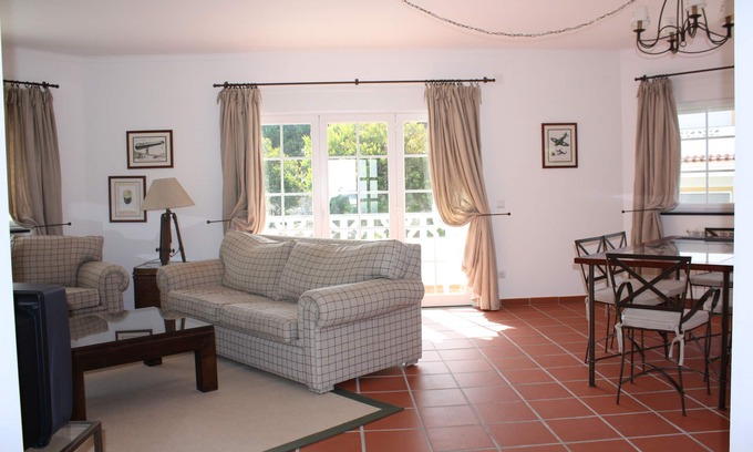 Praia del Rei Apartment | Apartment With Shared Pool, landscaped gardens, Wi-fi