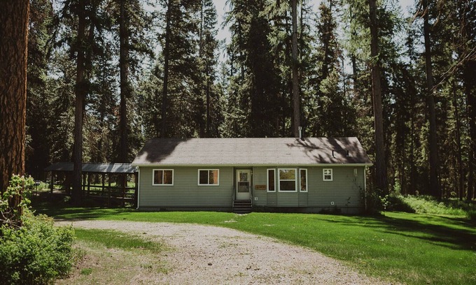 Seeley Lake House | Aspen Cabin at Tamaracks Resort. A view of the lake and expansive decks and yard