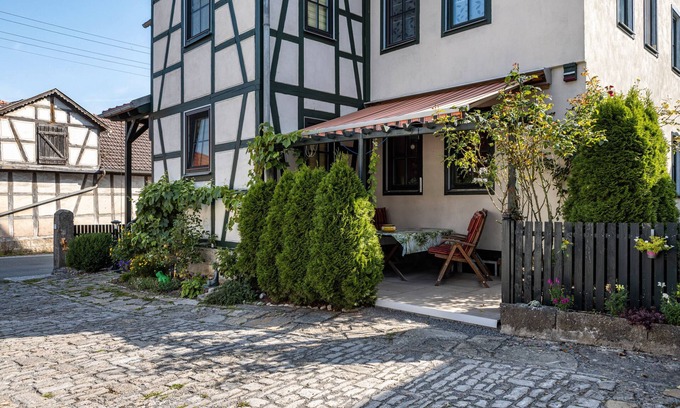 Dreißigacker Apartment | Attic Apartment in Country House Style