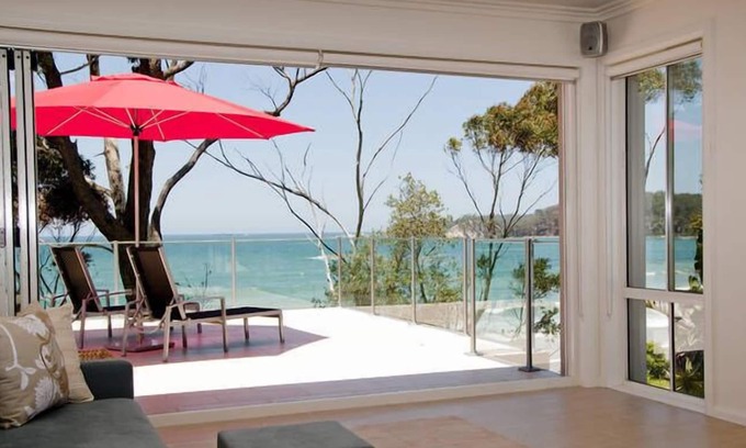 Denhams Beach Apartment | Beautiful and private apartment with large deck on Denhams Beach.