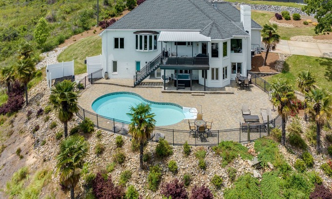 Rock Hill House | Beautiful Waterfront Home with abundant outdoor seating, pool, hot tub, grill
