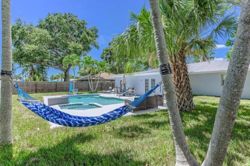 Palma Sola House | Blue Palm Home with Pool, Hot Tub, Nearby Beach, Outdoor Shower