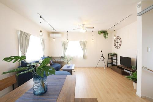 Ojima Island Apartment | blue sea and house