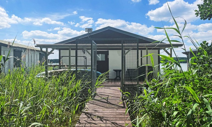 Lindow House | Bootshaus auf dem See by Interhome