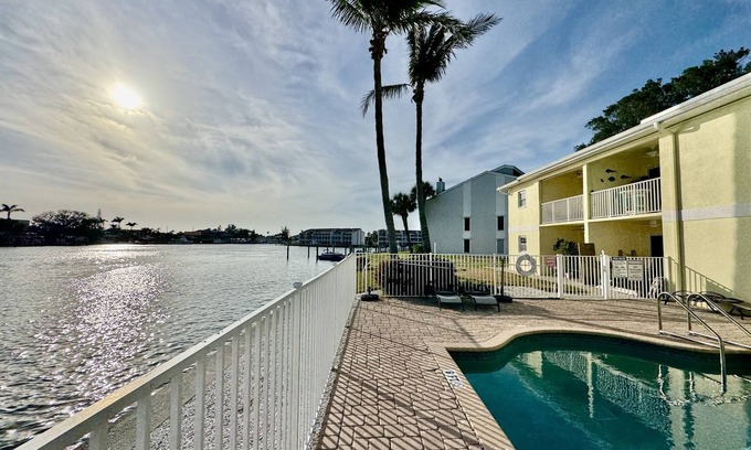 Capri Isle Condo | Canal-View Gem w/Pool in Treasure Island Paradise