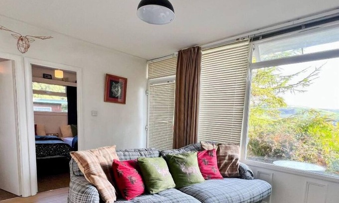 Bryn-crug Ski Chalet | Cedar Chalet in Snowdonia Wales. Stunning Woodland Views & Pool, Family & Pets