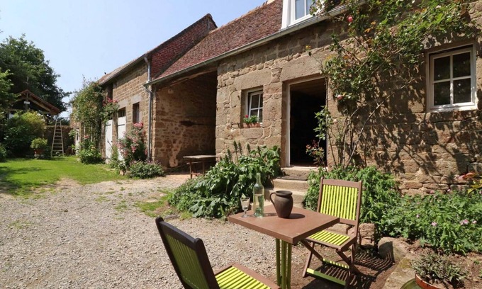 La Carneille Cottage | Charming 15th Century Cottage with Garden, Fishing Pond, and Historic Village Setting