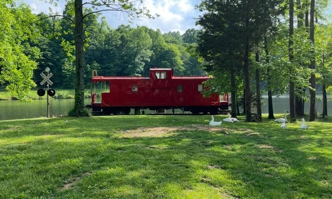 Freedom Bed & Breakfast | Charming Caboose-turned-tiny home on lake