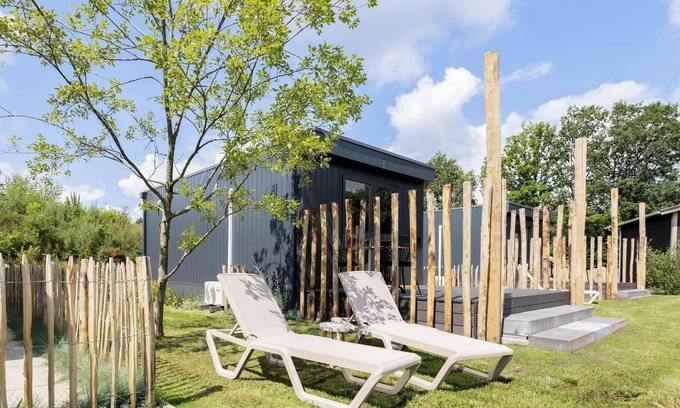 Gasselte House | Charming tiny house with a deck by the water. Relax, enjoy nature near ’t Nije Hemelriek and unwind – from sipping cappuccino in the sun to stargazing by the firepit.