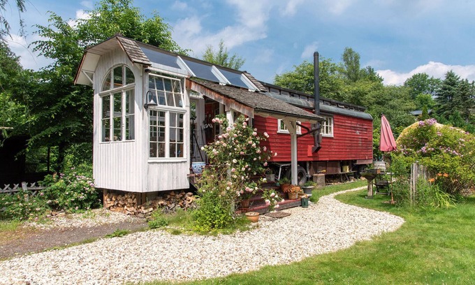 Windeck House | Circus wagon by the river