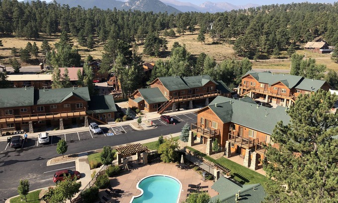 Estes Park Condo | Cliffside condo adjacent to pool. Grill & fire pit just steps away! 5 minutes to