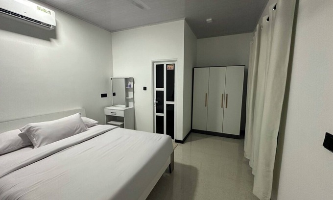 Thulusdhoo Island House | Close to the island's best spots, withncozy rooms and peaceful outdoor spaces.