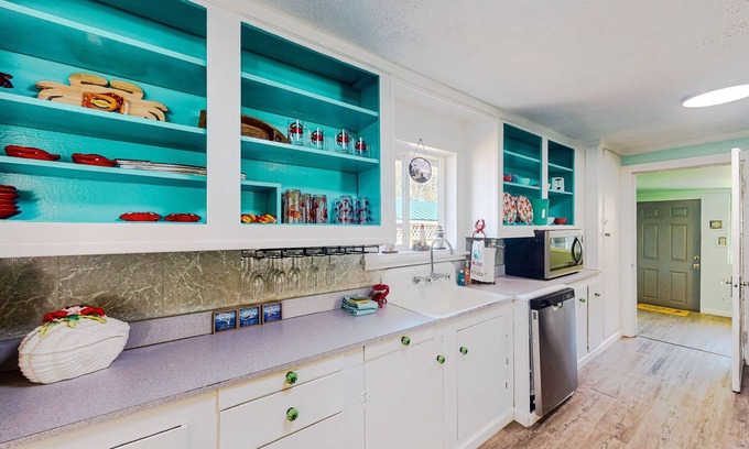 Winchester Bay House | Coastal home with an enclosed yard, hot tub, grill, fireplace, and W/D - dogs ok