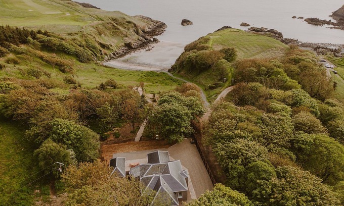 Stranraer Cottage | Coastal Magnificence: Saltwater Chronicles with private sea view deck.