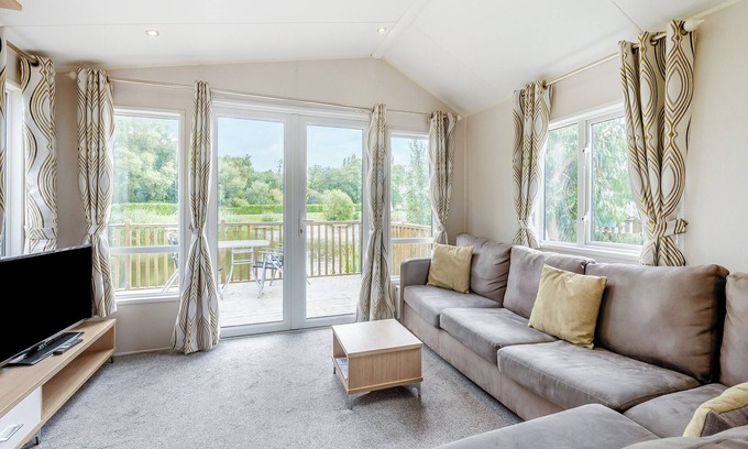 Ryther House | Comfortable caravan with one double with en suite shower room, and one twin.