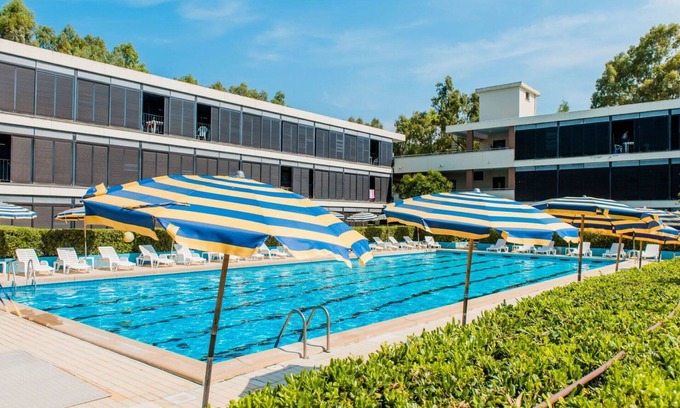 Marina di Bibbona Apartment | Cosy apartment for 4 guests with WIFI, A/C, pool, TV, terrace, pets allowed and parking