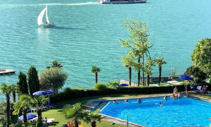 Bissone Apartment | Cosy apartment for 4 people with pool, A/C, WIFI, TV, balcony, panoramic view and parking