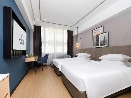 Shajing Hotel | Country Inn & Suites by Radisson Shenzhen International Convention and Exhibition Center