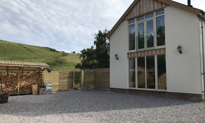 Graigfechan House | Countryside Home with jacuzzi hot tub, open plan living and wood burner.