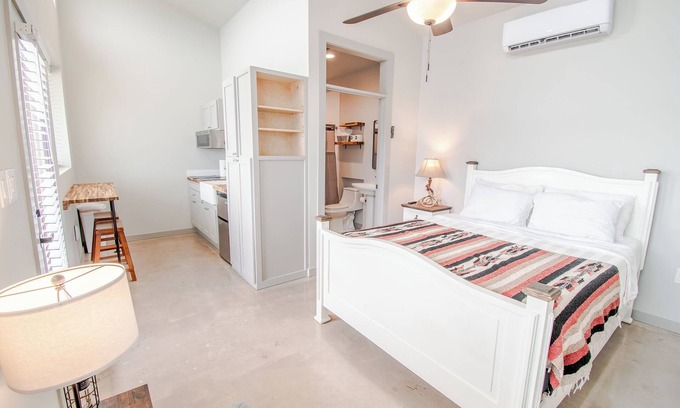 Uhland Cabin | Cozy cabin with queen bed, full kitchen, and refreshing walk-in shower.