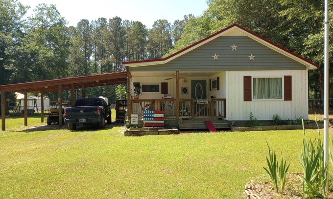 Summerton House | Cozy Cottage Just a Block From a Boat Landing and a Beautiful Pristine Lake