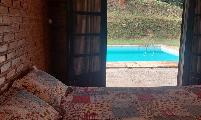 Areal Ski Chalet | Cozy suite with relaxing pool view surrounded by nature