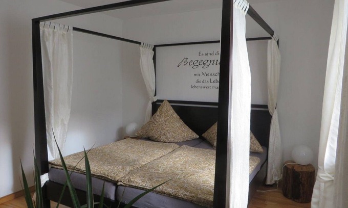 Grossheubach Apartment | Cozy vacation apartment (80 m2) with wooden terrace and sunbathing lawn