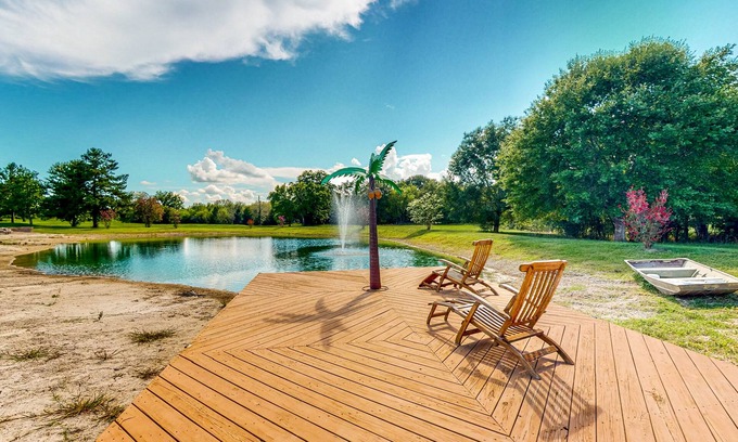 Waller House | Custom home with guesthouse, pond, sunning deck, beach & tropical bar