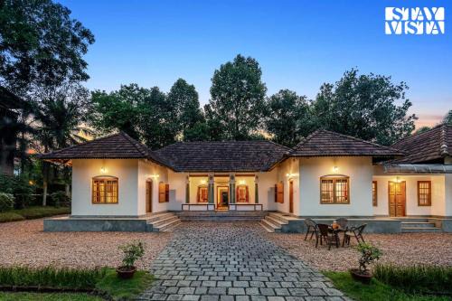 Tiruvalla Villa | CVM House with Lawn at Thiruvalla by StayVista