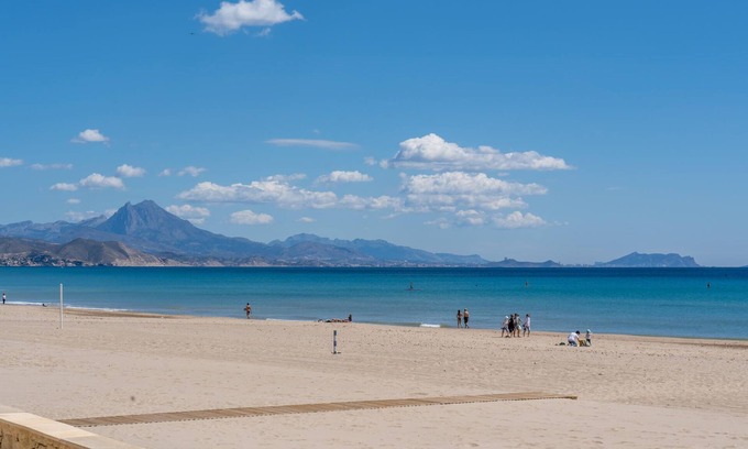 Muchamiel Apartment | Daylight friendly apartment with sea view and shared outdoor pool.