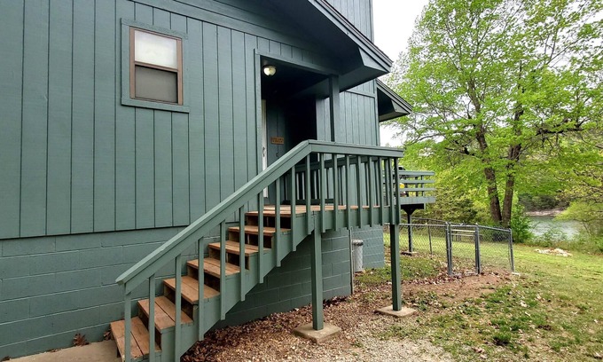 Holiday Island Condo | DECK OVERLOOKS THE PEACEFUL SERENITY OF THE LAKE
