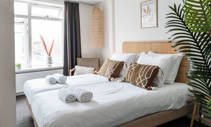 Zoutelande Apartment | Discover the charm of a stylish small seaside room with Ibiza vibes, featuring a private bathroom.